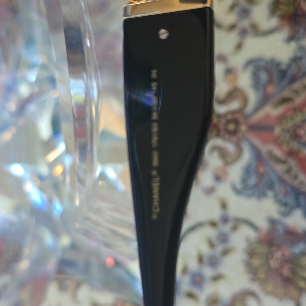 Elegant Black CHANEL Sunglasses with Gold Accents - Picture 3 of 5